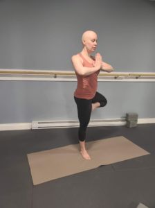 An image of a white woman in the yoga form Tree, Melissa Holt teaching Yoga for Anxiety